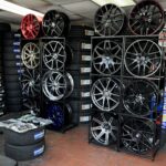Display of custom alloy wheels and rims inside Titan Tire and Wheels shop in Madison, TN